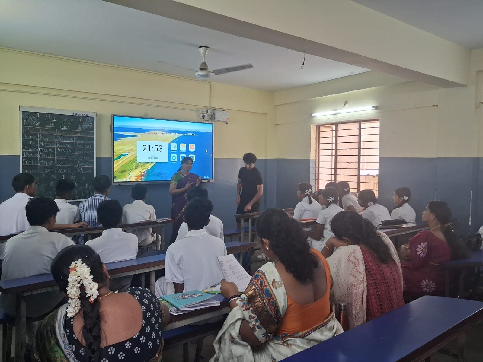 A Finance For All volunteer presenting to a government school class