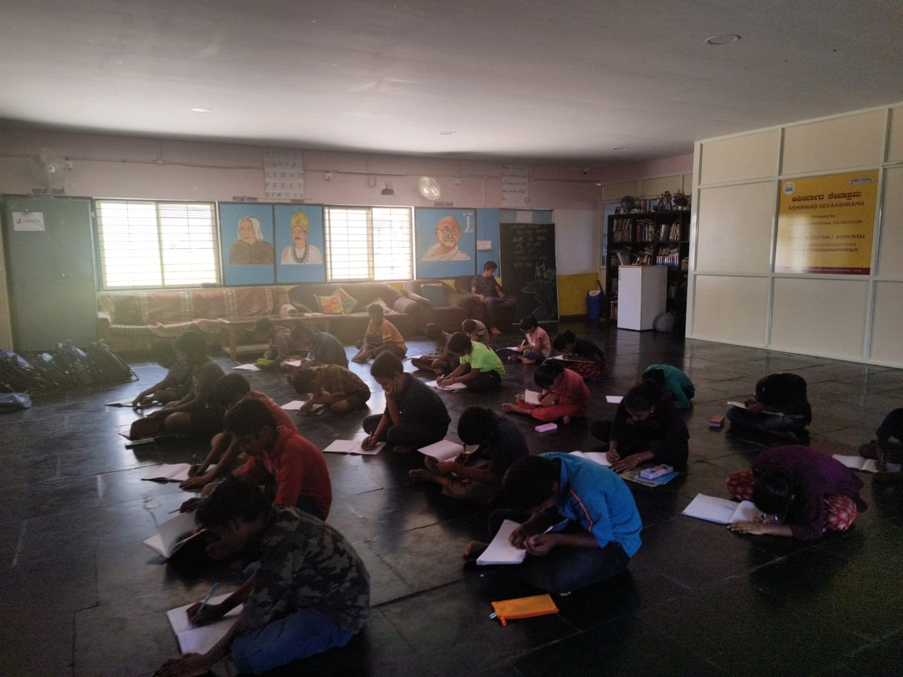 Children working through a written exercise during a Finance For All workshop